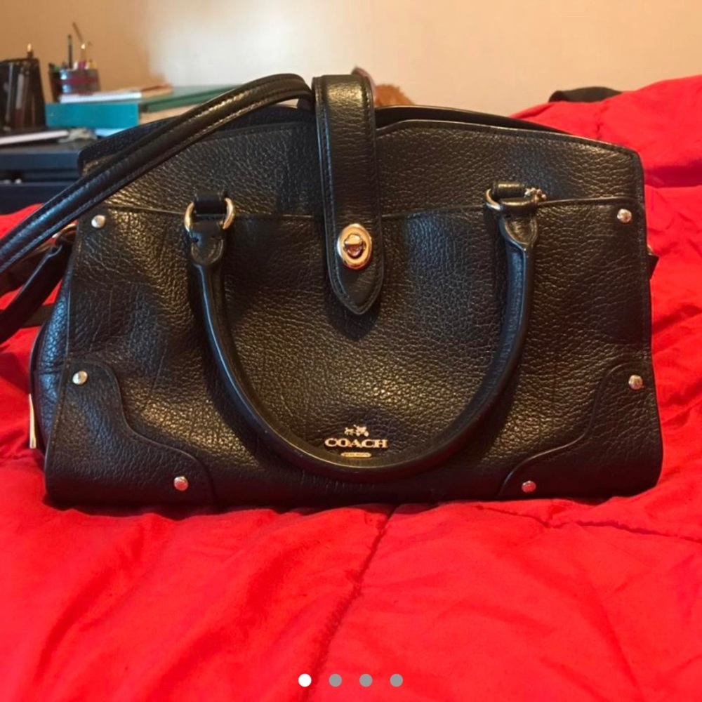 Mini black leather Coach purse.